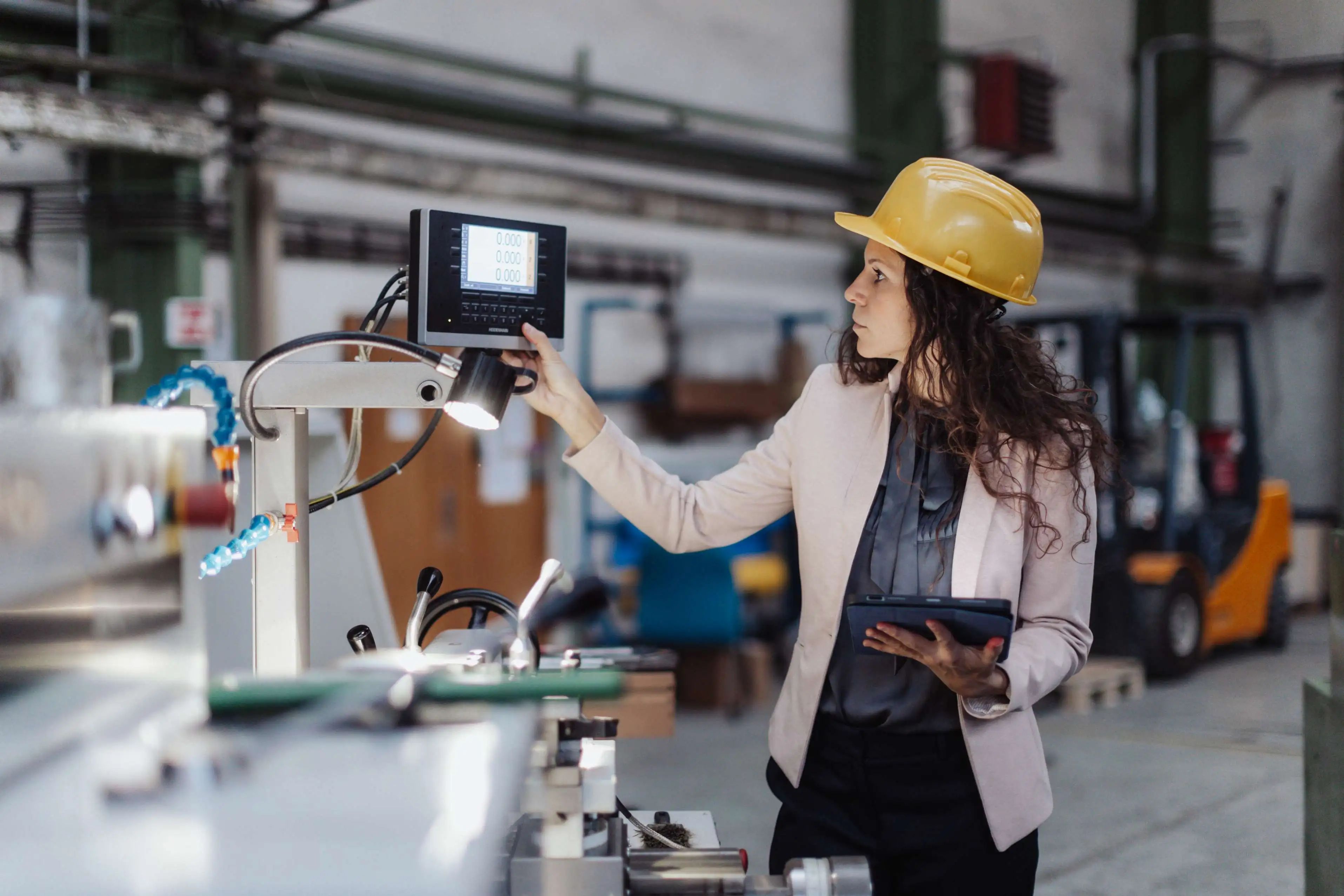 Dynamics Monk preventive quality management in manufacturing, with an engineer monitoring production equipment and real-time quality data to prevent defects.